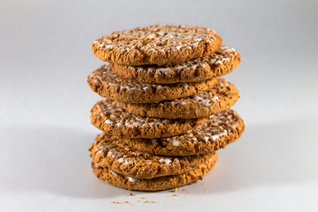 A close-up of a stack of delicious homemade cookies with icing, perfect for indulgence.